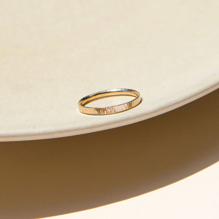 14k solid gold textured ring in the sunlight