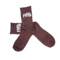 Mahd Metal Socks: Brown riding socks with a white abstract side design, crafted from a soft bamboo blend. One size fits most; shown on a white background.