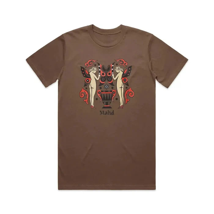 The Mahd Wesley Tee showcases a bold tattoo-style print: two nude women with butterfly wings, vivid red and black details, a central urn, and "Mahd" beneath—an ideal fit for Cape Town’s creative vibe.