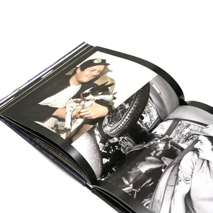 The MAINTAIN - IV.V "DERAILED" Book includes a photo of a man holding a small dog and another by Rob Dolecki showing a man in a vehicle surrounded by assorted items.