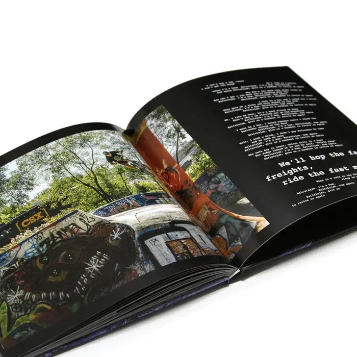 The MAINTAIN - IV.V "DERAILED" Book by Rob Dolecki features a striking BMX photo of graffiti-covered train cars on one page and bold white text on a black background on the opposite page.