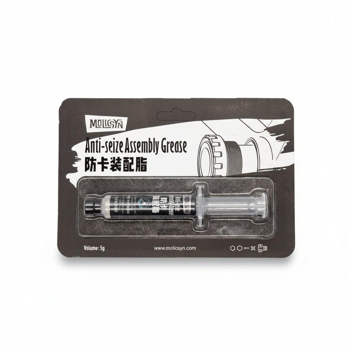 A 5g syringe of MolicSYN Prime Anti-Seize Grease, a high-performance bike anti-seize lubricant, in black packaging with English and Chinese text and a background graphic of gears.