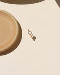 Close-up of stackable moonstone glow ring with iridescent shimmer in gold fill