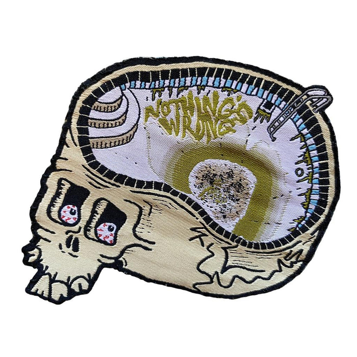 The Nothings Wrong Drain Brain Patch features a skull with a swimming pool inside, "Nothing’s Wrong" graffiti on the wall, and a diving board—a unique iron-on patch for that Brain Drain vibe.