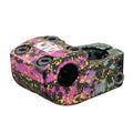 Odyssey Nord Stem (40th Anniversary) (22.2mm Clamp) featuring a vibrant pink, yellow, blue, and black splatter paint design, multiple bolts for secure mounting, and a commemorative logo on top.