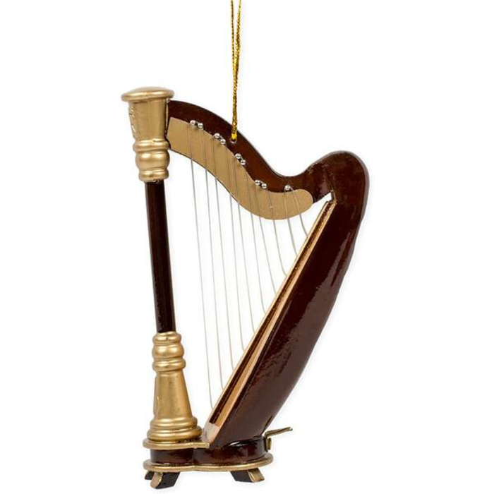 A miniature harp-shaped ornament with a glossy dark brown body, gold-toned neck and base, and strings, hanging by a gold string against a plain white background.