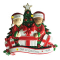 Interracial Couple Opening Presents on Christmas Ornament