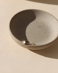 14k gold fill bezel ring with 4mm pearl stone in a light dish