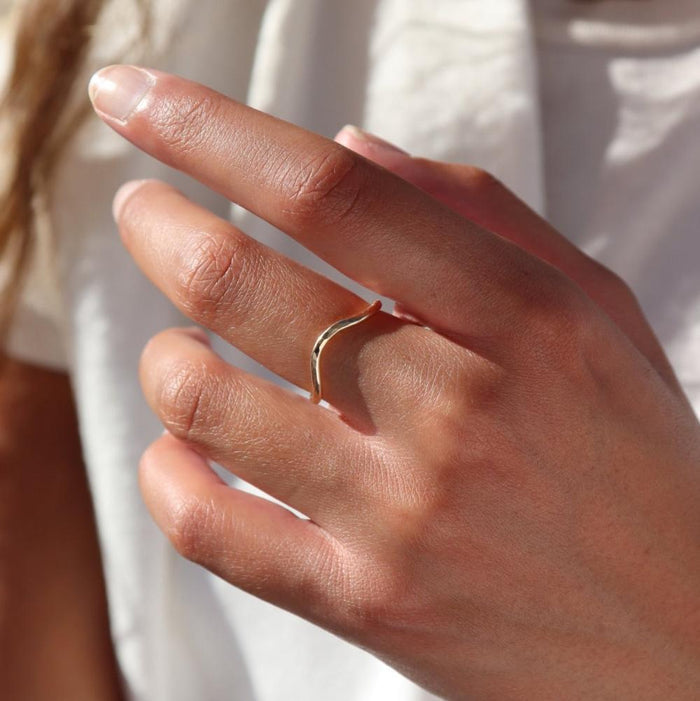 model wearing 14k gold fill hammered ring with plunge detail