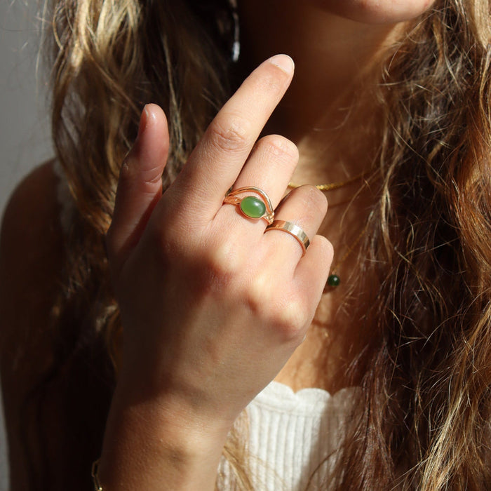model wearing 14k gold fill hammered ring with plunge detail with other 14k gold fill rings