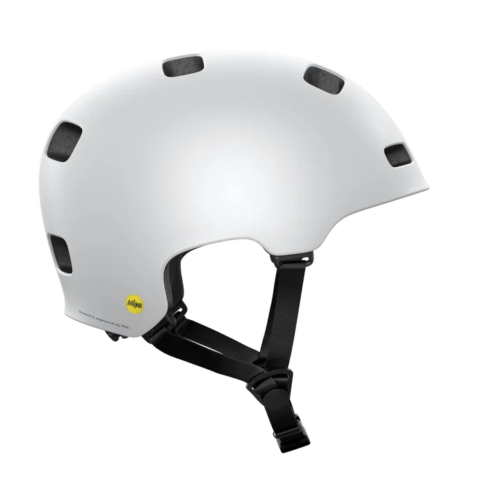 The POC Crane MIPS Helmet in Matte White features multiple ventilation holes, black adjustable straps, a dual-density liner for protection, and a yellow MIPS safety label on the lower back for rotational impact safety.