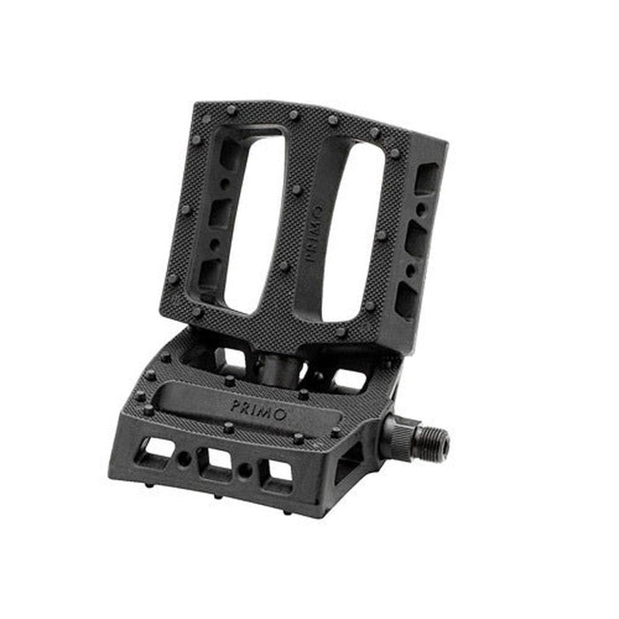 The Primo JJ Palmere Signature Plastic Pedals are black bicycle pedals featuring a rectangular design, textured surface, and multiple cut-outs for optimal grip. Shown at an angle against a white background, these impact-resistant pedals are built for performance and equipped with strong chromoly spindles to ensure enhanced durability on every ride.