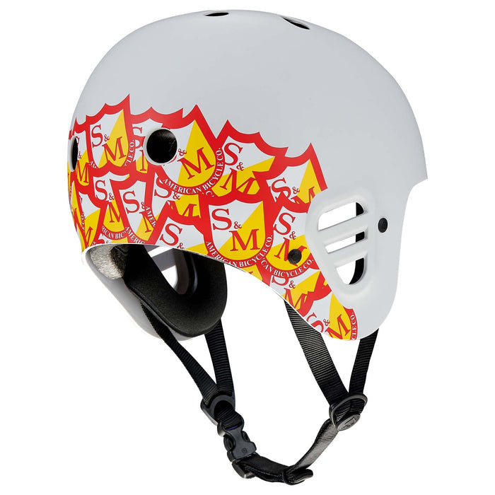 Protec Full Cut Helmet / S&M Signature Light Grey featuring red and yellow shield-shaped S&M logos on the sides, black straps, and ventilation holes on the top and sides—engineered for high-impact protection in action sports.