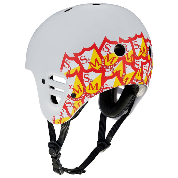 Light grey Protec Full Cut helmet featuring the S&M signature red and yellow logo pattern on the side, black straps, ventilation holes, and high-impact protection—perfect for action sports.