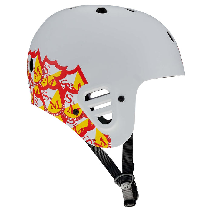 The Protec Full Cut Helmet / S&M Signature in Light Grey features a red and yellow shield pattern on the side, ventilation holes, and an adjustable black chin strap for high-impact protection.