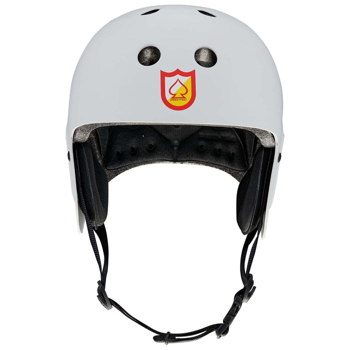 S&M Signature Light Grey Protec Full Cut Helmet: crafted from high-impact ABS with ventilation holes, black interior padding, an adjustable chin strap, and a red-and-yellow shield logo with a spade symbol on the front—ideal for action sports.