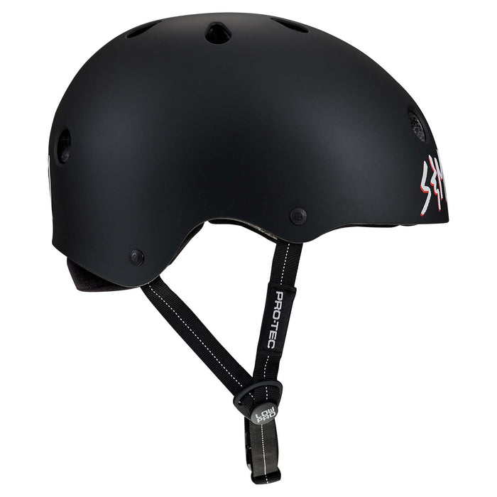 Protec S&M Low Pro Certified Helmet featuring a matte black finish, ventilation holes, an adjustable chin strap with “PRO-TEC” branding, and high-impact ABS construction for reliable safety.