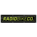 The Radio Contest Banner is a rectangular black PVC sign with yellow-green "RADIOBIKECO." text and edge mounting holes—ideal for outdoor use or displaying your favorite BMX brand.