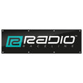 The Radio Raceline Shop Banner is a rectangular black banner featuring the "Radio Raceline" logo in white and teal text with a stylized "R" on the left, ideal as a hanging sign or display for your shop or workshop.