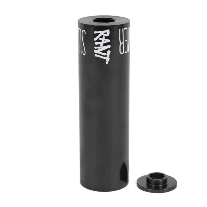 The Rant Slimmer Peg (Each) is a black cylindrical BMX peg featuring "RANT" branding, displayed upright beside a metal spacer—ideal for riders wanting a durable yet lightweight bike peg.