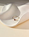 14k gold fill thin ring band with a 4mm red garnet stone