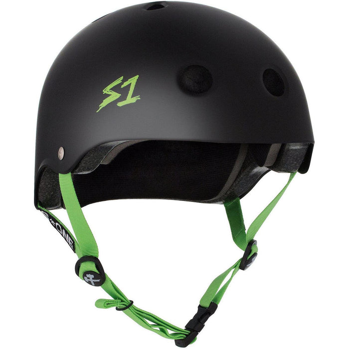 The S-One Helmet Lifer in Black Matte with Green Straps boasts a sleek design featuring ventilation holes, an adjustable chin strap, and is enhanced with EPS Fusion Foam for multiple impact protection, ensuring both safety and style.