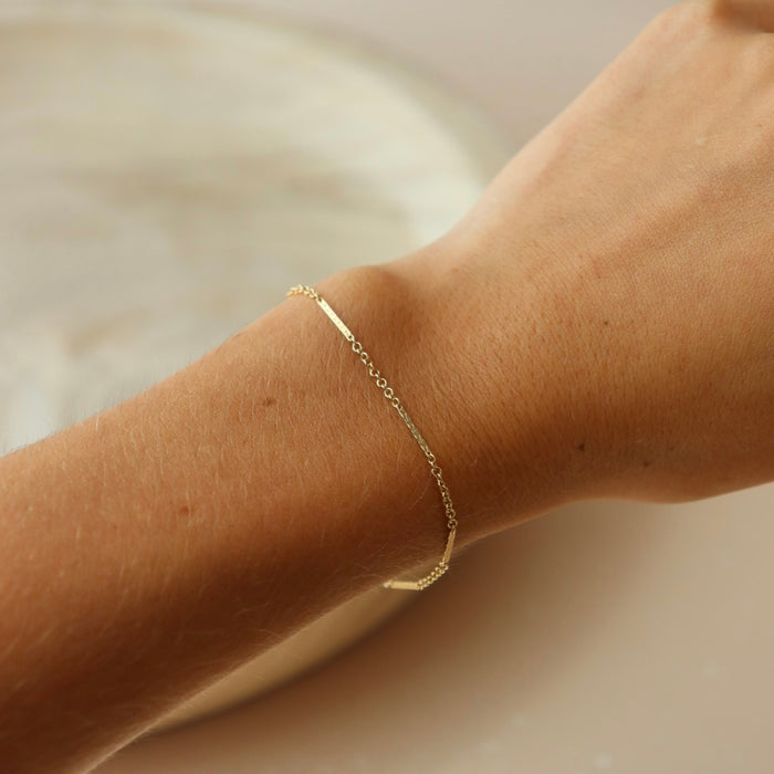 Model wearing the Sailor bracelet a bar and link dainty chain bracelet