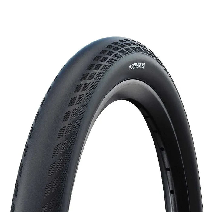 Close-up of a black Schwalbe SX-R 20 Inch Tyre with a textured tread pattern, shown against a white background.
