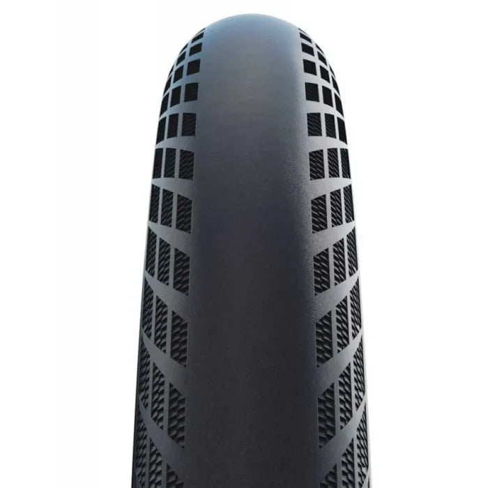 Close-up view of a single Schwalbe SX-R 20 Inch Tyre in black, featuring a geometric tread pattern, photographed from above against a plain white background.