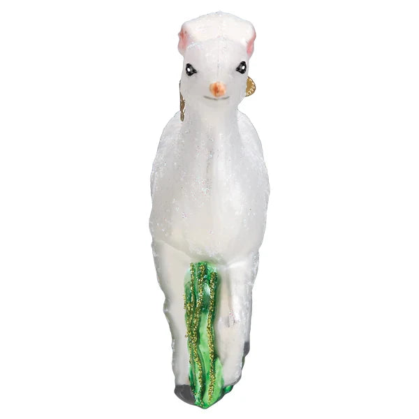 Seneca White Deer Christmas ornament with glitter standing on green tall grass.