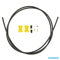 Shimano BH59-SB Disc Brake Hose kit includes a black hose, straight connect fitting, two yellow spacers, connectors, and small metal fittings.