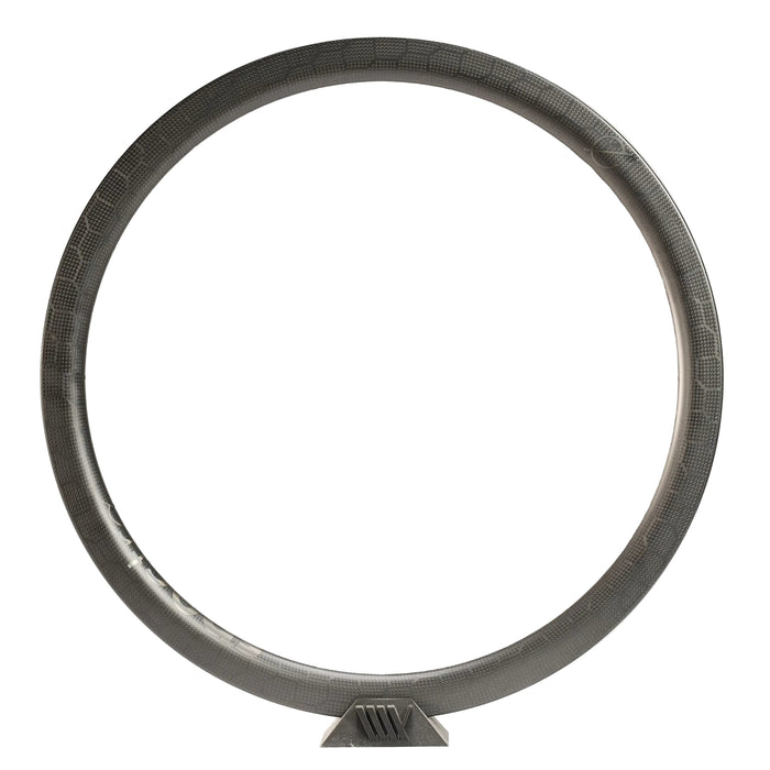 The Spectre V3 Carbon Fiber 451 28H Brakeless Rim, featuring a unidirectional finish and textured surface, stands upright on a small angled base against a plain white background.