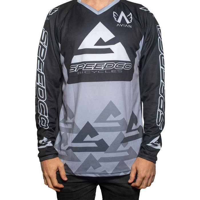 A man sporting a Speedco Race Jersey in shades of grey and black.