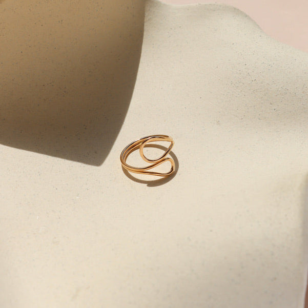 14k gold fill sculptural ring on a light dish