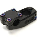 The Stranger Haze V2 Top Load Stem is a black BMX bike stem featuring six rainbow-colored bolts; CNC machined for strength and precision, it securely connects your handlebars to the fork.