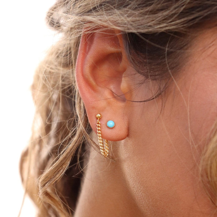 Model wearing 14k gold fill small curb chain stud earrings with turquoise stud earrings