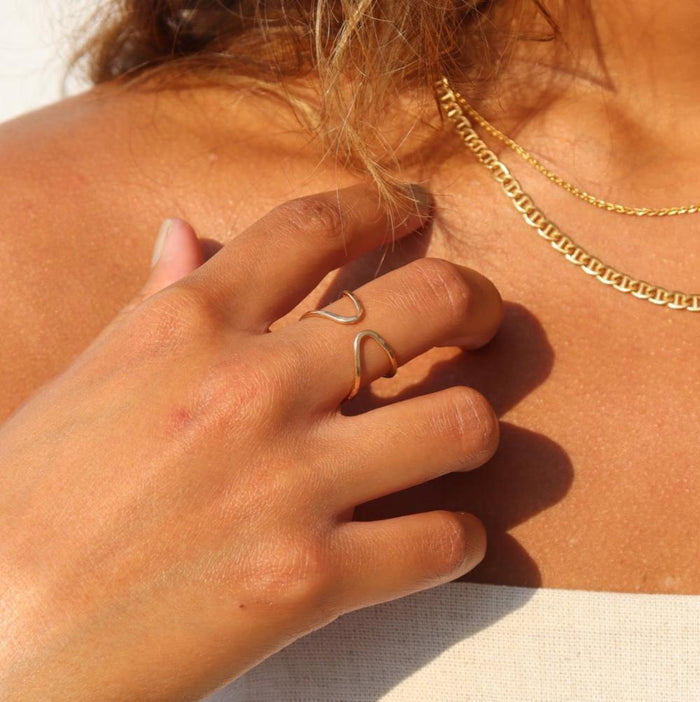 model wearing 14k gold fill hammered and hand shaped ring