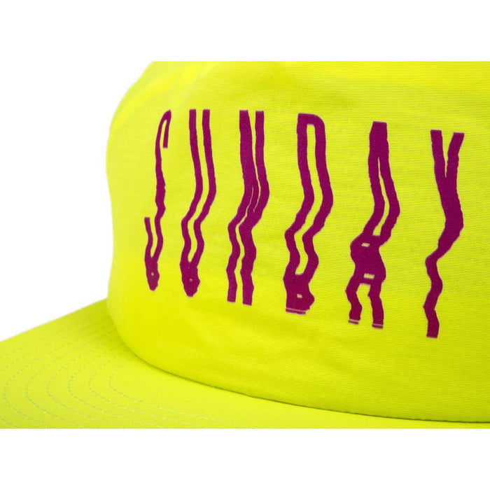 The Sunday High Wave Cap is a yellow Snap Back with "SUNDAY" in bold wavy purple letters—perfect for your Back to School 2025 style.