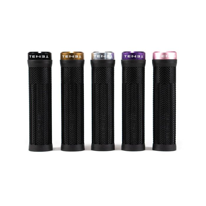 Five Tenet Components Icon Grips in black, each with a textured surface and a distinctively colored metal lock-on end cap in black, gold, silver, purple, and pink. These extra-soft rubber grips offer superior comfort and control for your mountain bike rides.