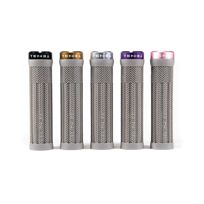 Introducing the Tenet Components - Icon Grip: a set of five grey, cylindrical mountain bike grips featuring textured patterns and topped with individual colored caps—black, gold, silver, purple, and pink. These lock-on grips are crafted from extra soft rubber to deliver superior comfort and control on every ride.