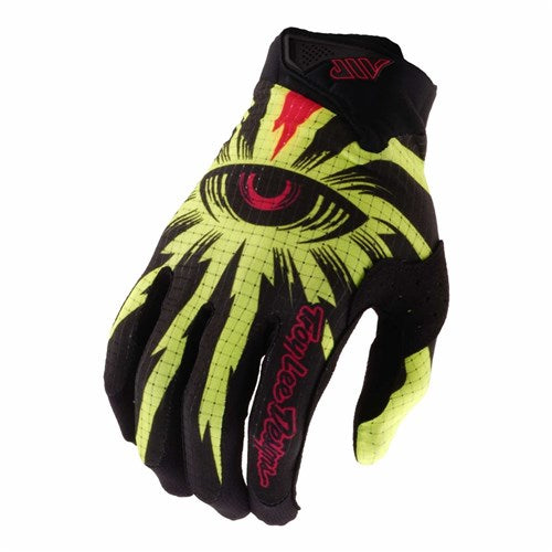 The TLD 26.1 Air Glove / Cyclops Black is a black and yellow glove with a red and yellow eye graphic, pink "Troy Lee Designs" lettering, and an ergonomic fit for comfort.