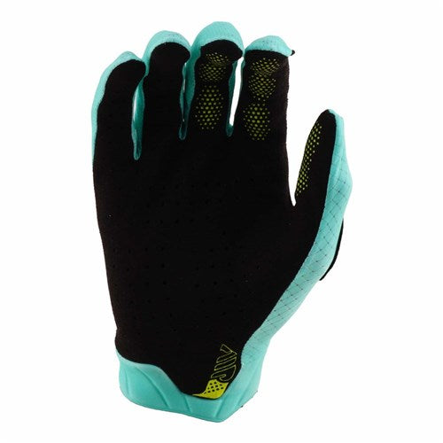 The TLD 26.1 Air Glove / Mono Real Teal features a black design with teal accents, perforated material, and a yellow cuff logo—ideal for riders wanting premium Troy Lee Designs mountain bike gloves.