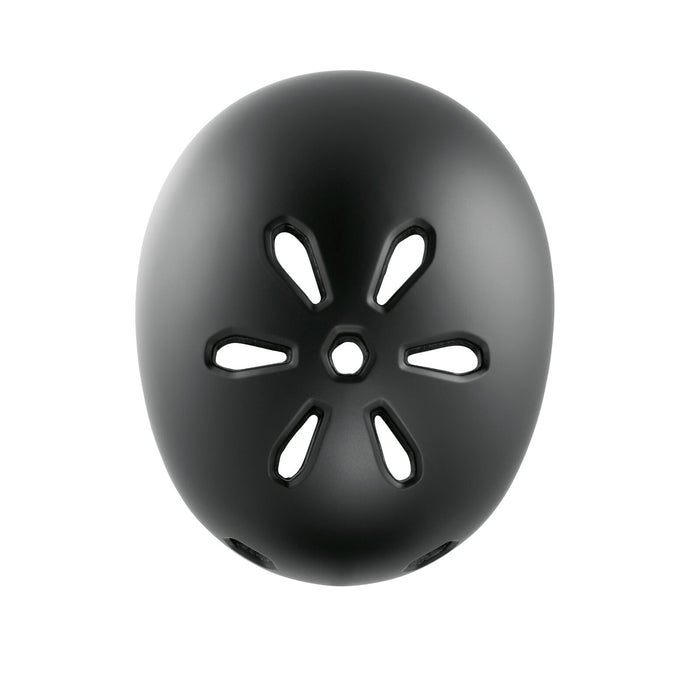 The TSG Meta Helmet Satin Black is a lightweight BMX helmet with in-mold construction, featuring six elongated oval vents arranged circularly around a central round vent when viewed from above.