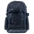 The United Dayward Backpack showcases a black design with two front buckles, side pockets, a subtle geometric logo, and skateboard carry straps, all set against a white background.