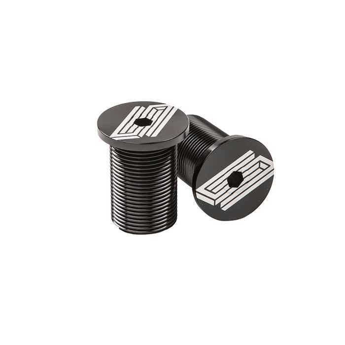 Two black, cylindrical United Fork Caps with geometric white designs and hexagonal drive sockets—compatible with M24 threads—are displayed on a white background.