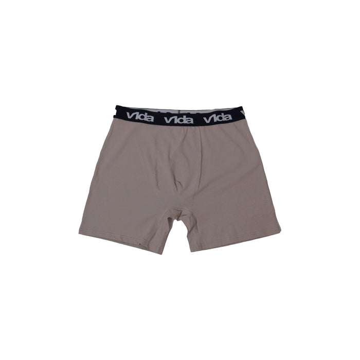 The V1da Boxer Briefs (2 Pack) are beige men's mid-length cotton boxers with a black waistband featuring repeated white "Vida" text, updated for comfort.
