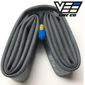 The Vee 24 Inch Tube (Schrader Valve), a coiled latex inner tube sized 24 x 1.50-24 x 2.25 with a visible Schrader valve and blue cap, is displayed next to the Vee Tire Co. logo in the top right corner.