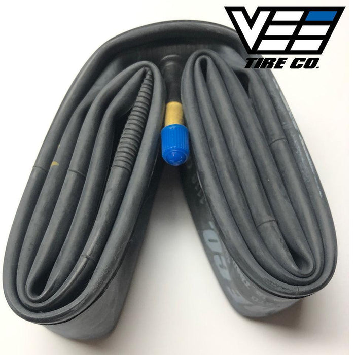 The Vee 24 Inch Tube (Schrader Valve), a coiled latex inner tube sized 24 x 1.50-24 x 2.25 with a visible Schrader valve and blue cap, is displayed next to the Vee Tire Co. logo in the top right corner.