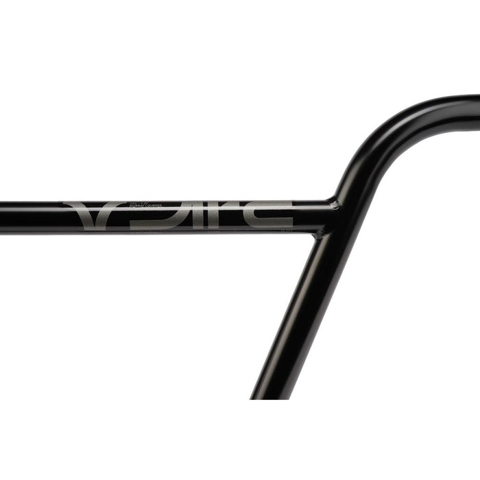 Close-up of a black Wethepeople ARC (Murray Loubser) Bars / OS 25.4mm Clamp street BMX handlebar, featuring a silver “Eclat” logo on the crossbar. Crafted from durable 4130 chromoly and photographed against a white background, this Murray Loubser signature model exemplifies both strength and style for demanding riders.