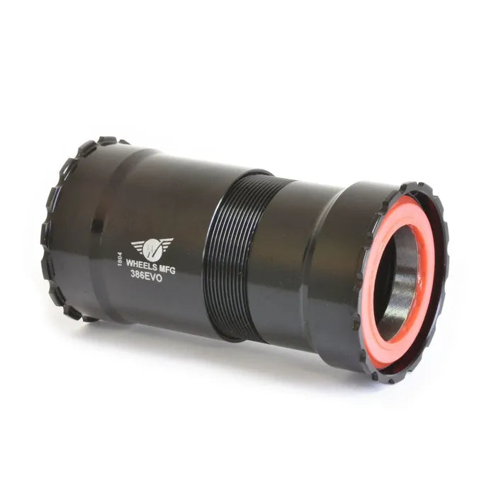 Black cylindrical Wheels MFG 386EVO DUB Threaded BB shown on a white background, featuring a red inner seal; this bottom bracket is compatible with SRAM DUB.